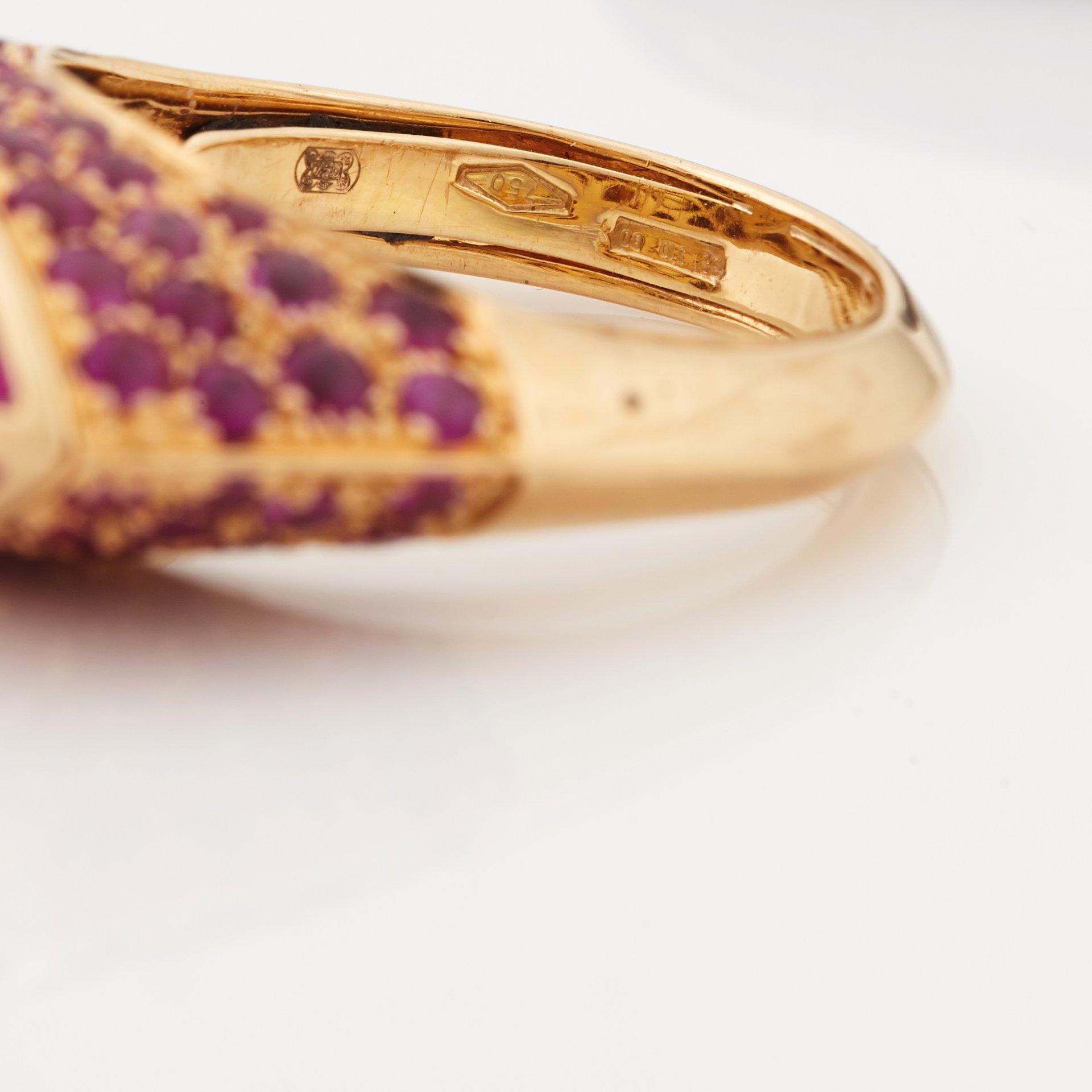 A ruby, diamond and black enamel ring.