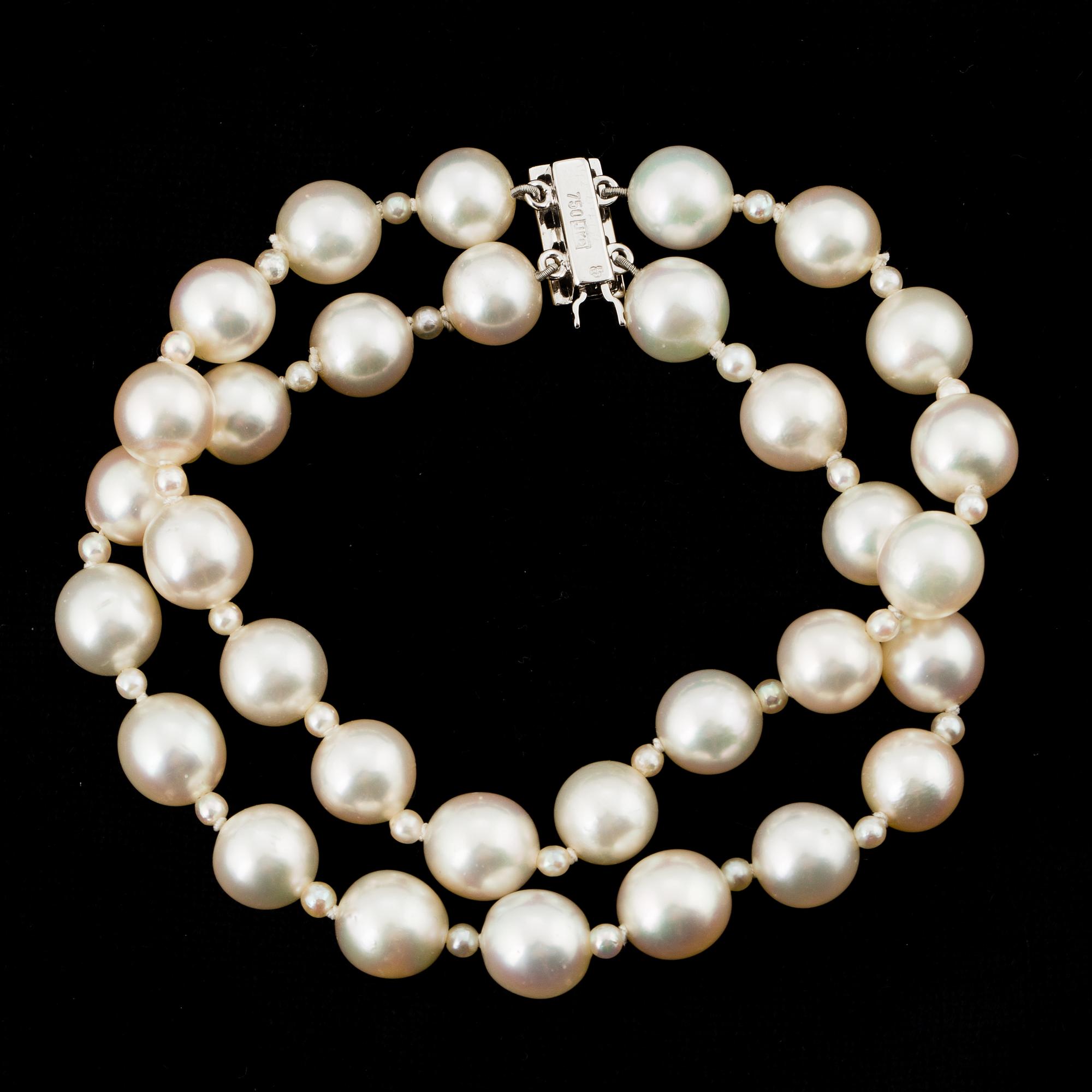 PEARL BRACELET, 2 strands of Akoya pearls with small pearls in between.