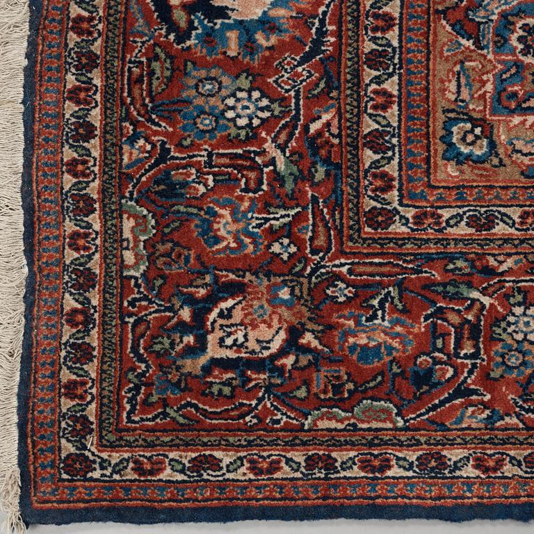 A CARPET. A semi-antique Kashan part silk. 248,5 x 136 cm.