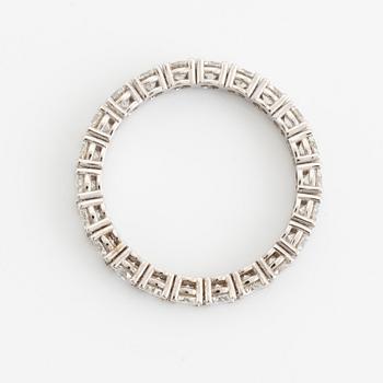 Brilliant cut diamond eternity ring.