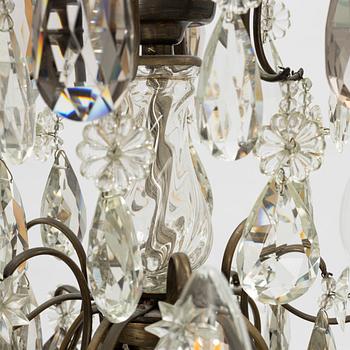 Takkrona, rokokostil, 1900-talets första hälft.