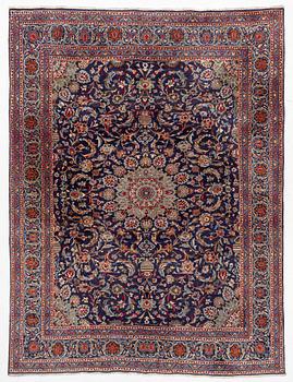 An oriental carpet, c. 390 x 295 cm.