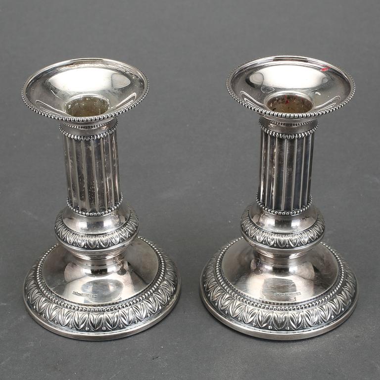 LJUSSTAKAR, ett par, silver, Turku/Åbo, omkring 1900-talets mitt.