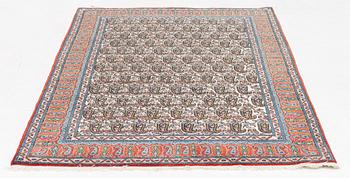 An oriental rug, c. 207 x 138 cm.