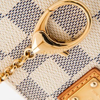 Louis Vuitton, a Damier Azur 'Milla MM Pochette' bag.