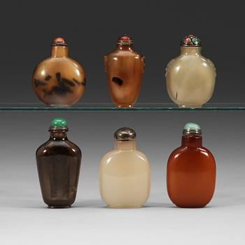 54. A set of five agate and one smokey quarts snuff bottles, late Qing dynasty (1644-1912).