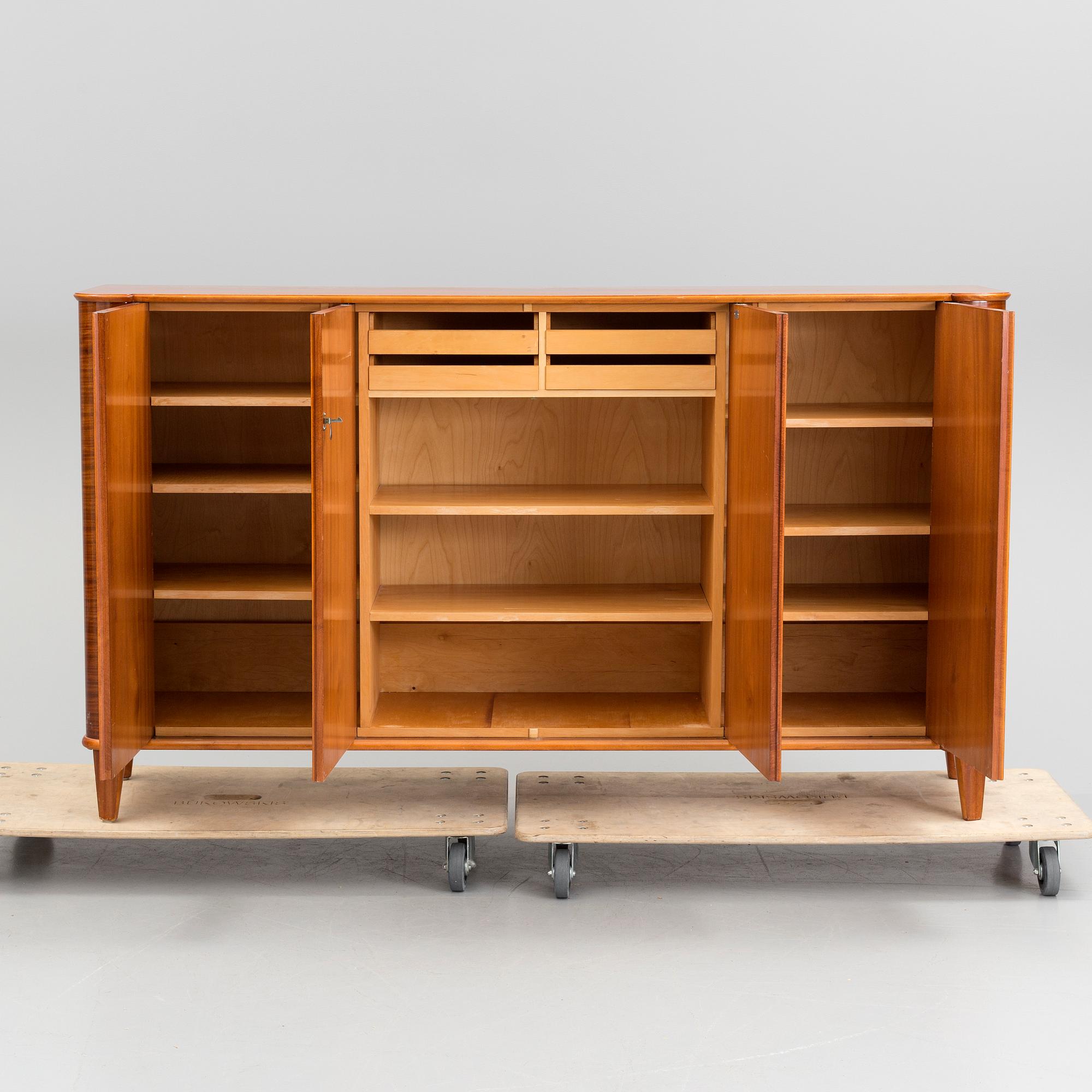 A 20th century mahogany sideboard with four doors. - Bukowskis