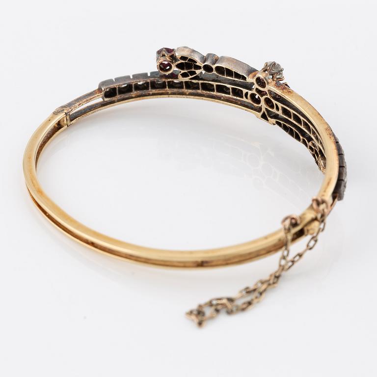 Arm ring in gold and silver set with old-cut and rose-cut diamonds and rubies.