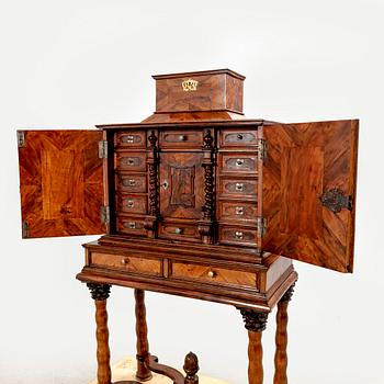 A first half of the 18th century walnut cabinet.