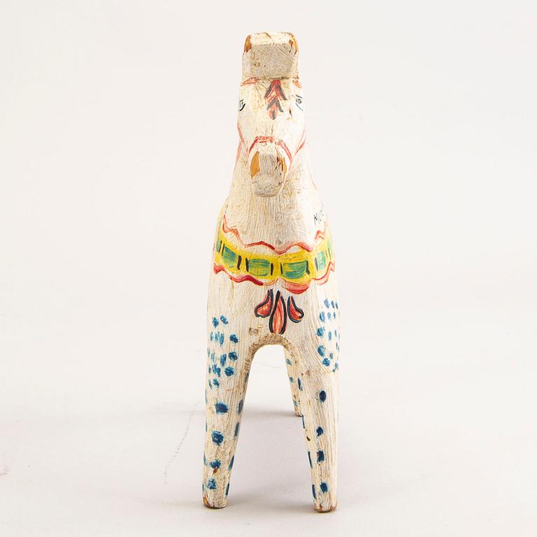 A Swedish painted and dated 1945 wooden horse.