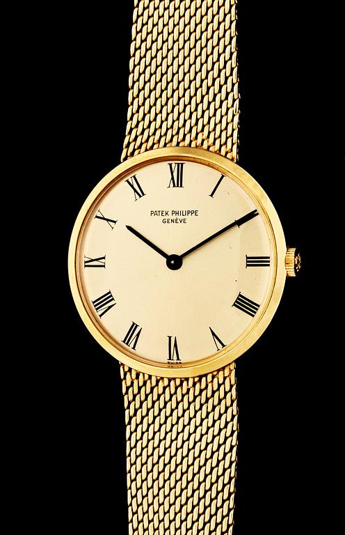 An 18k gold Patek Philippe watch.