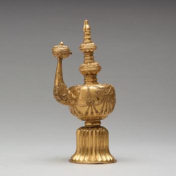 A Tibetan gilt copper bumpa, 19th Century.