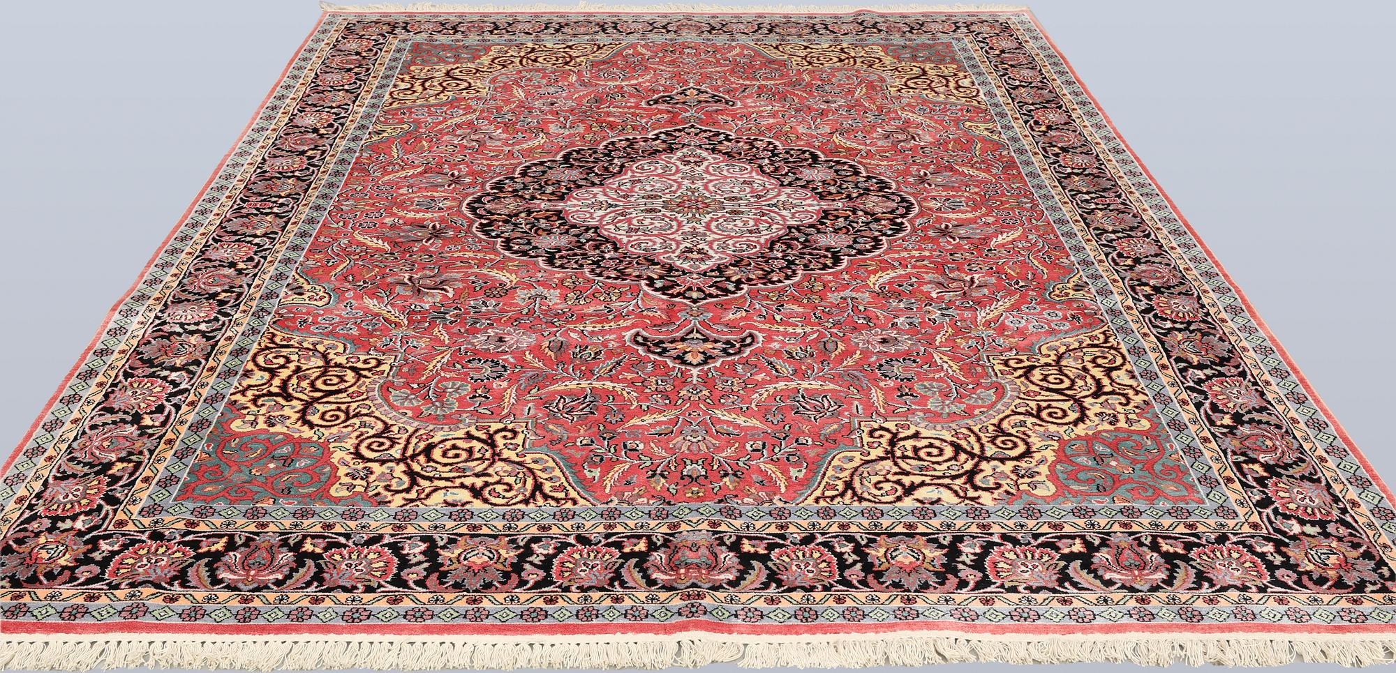 A Kashmir silk carpet, approx. 305 x 216 cm.