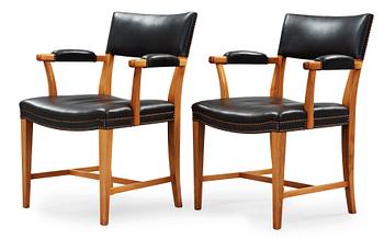 467. A pair of Josef Frank walnut and black leather armchairs, Svenskt Tenn, model 695.