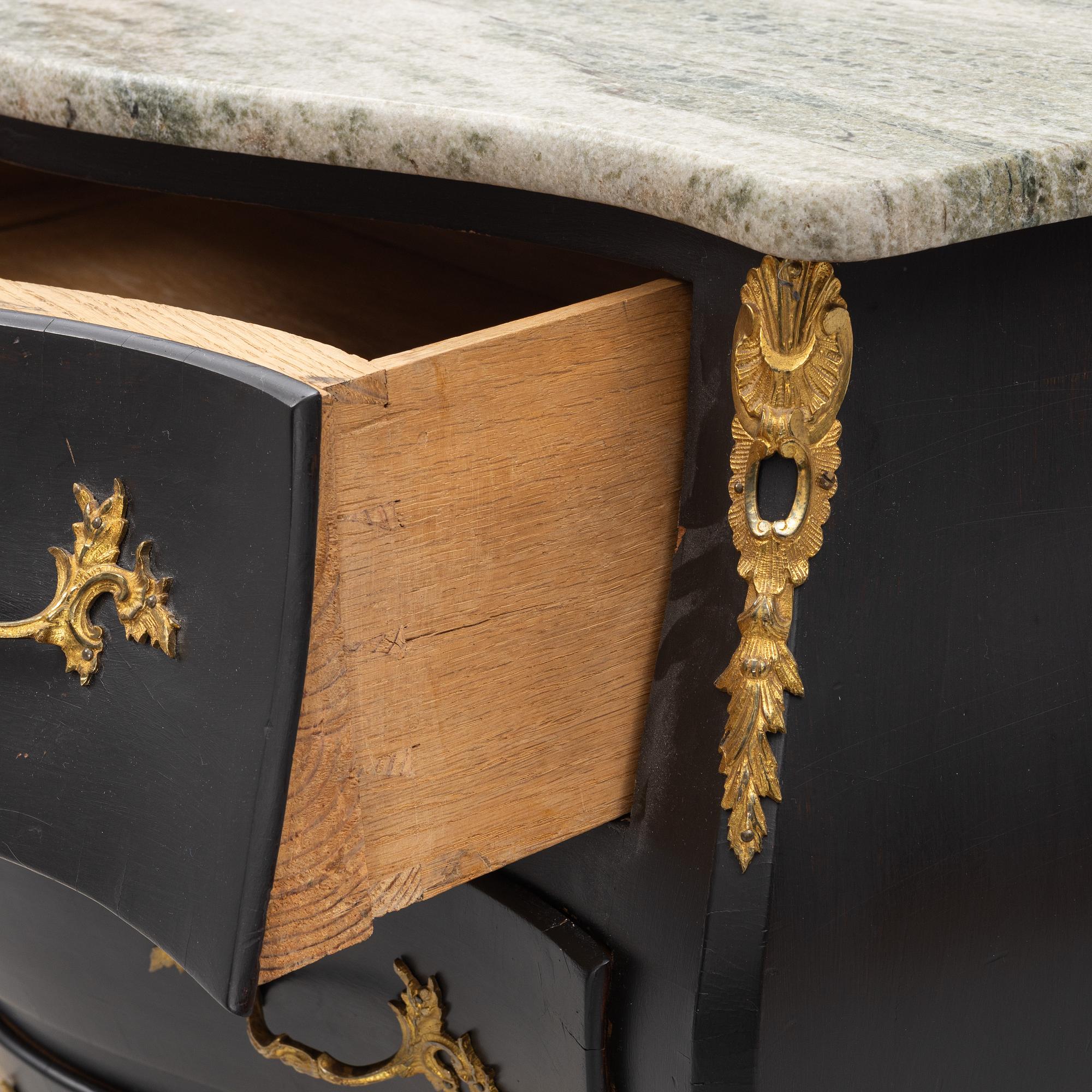 A Rococo style chest of drawers, mid 20th Century.