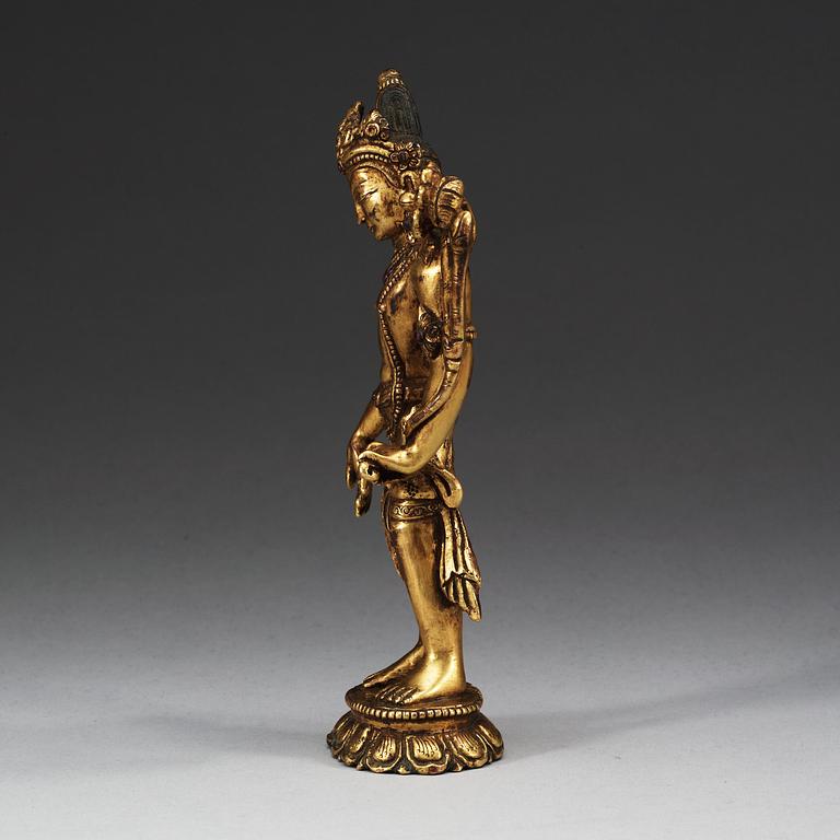 A gilt and stone-inlayed bronze figure of Tara, Nepal, 19th Century.