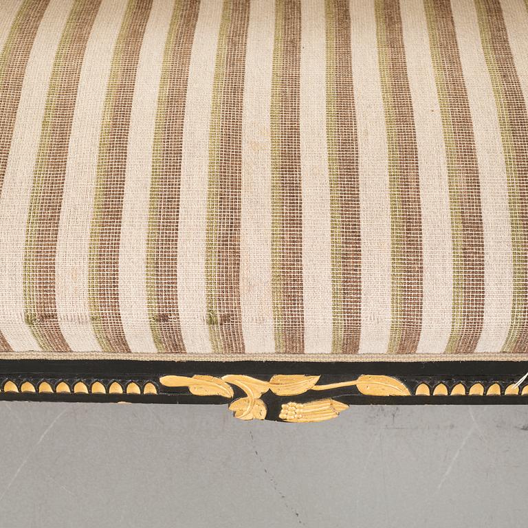 A gustavian style table and sofa, around the year 1900.