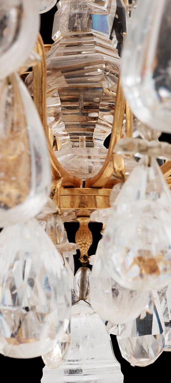 A late Baroque-style circa 1900 rock crystal twelve-light chandelier.