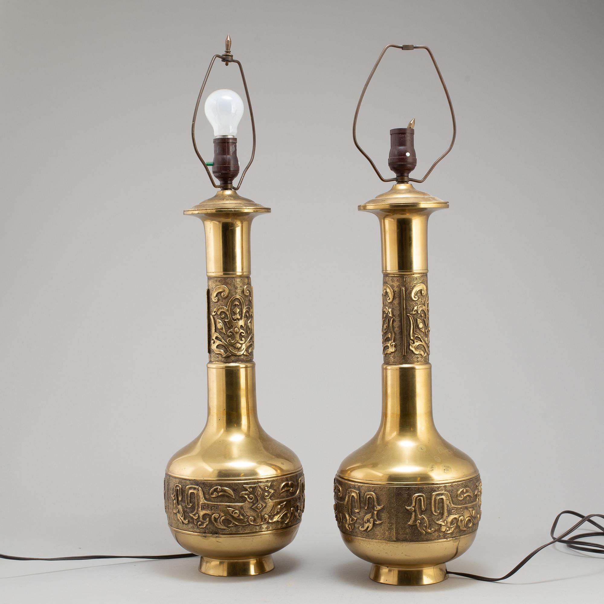 A pair of Chinese brass table lamps, 20th century.
