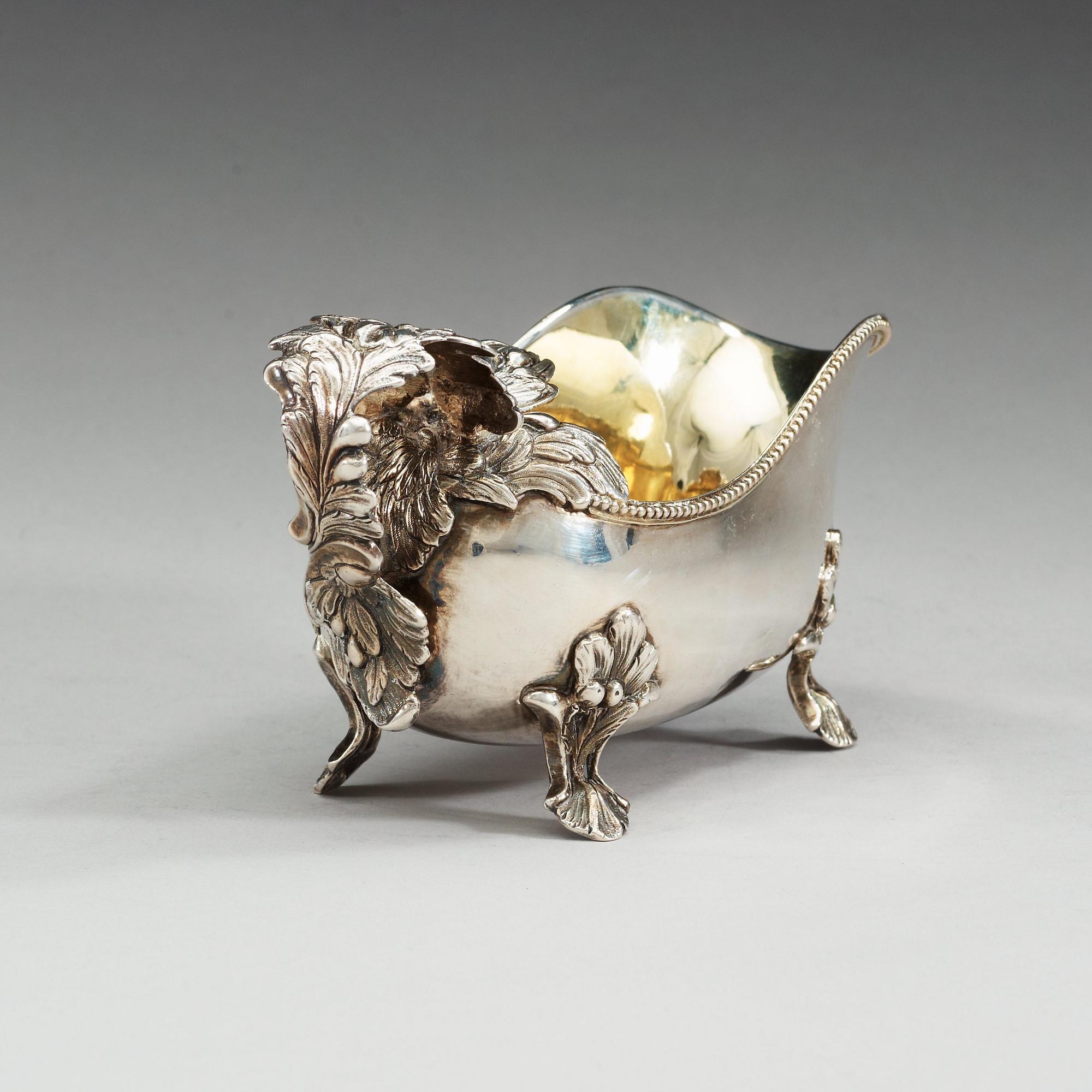 A Swedish 18th century parcel-gilt cream-jug, makers mark of Anders Schotte, Uddevalla 1793.