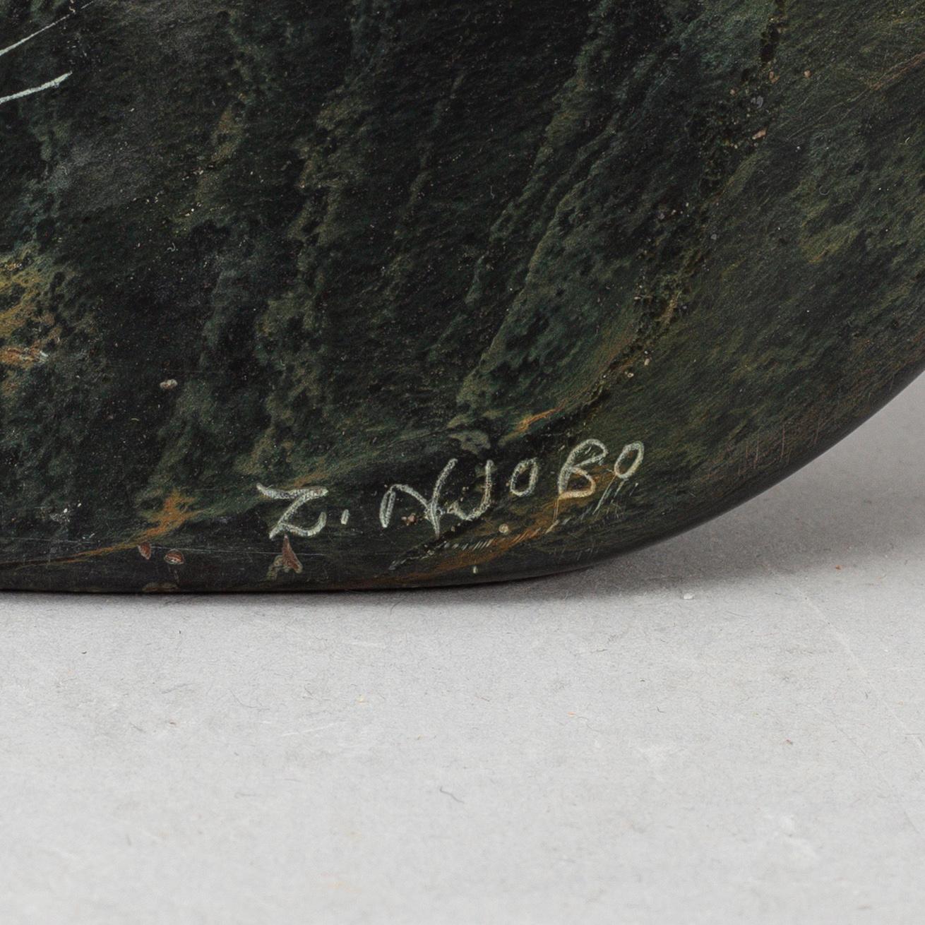A ZACHARIAH NJOBO stone sculpture, signed.