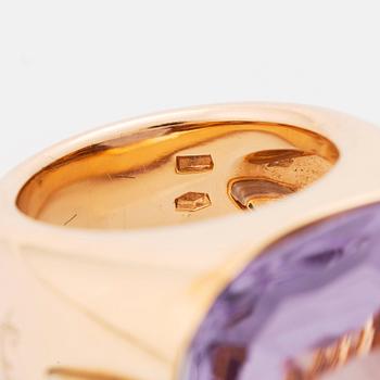 A Pomellato ring set with amethysts and round brilliant-cut diamonds.