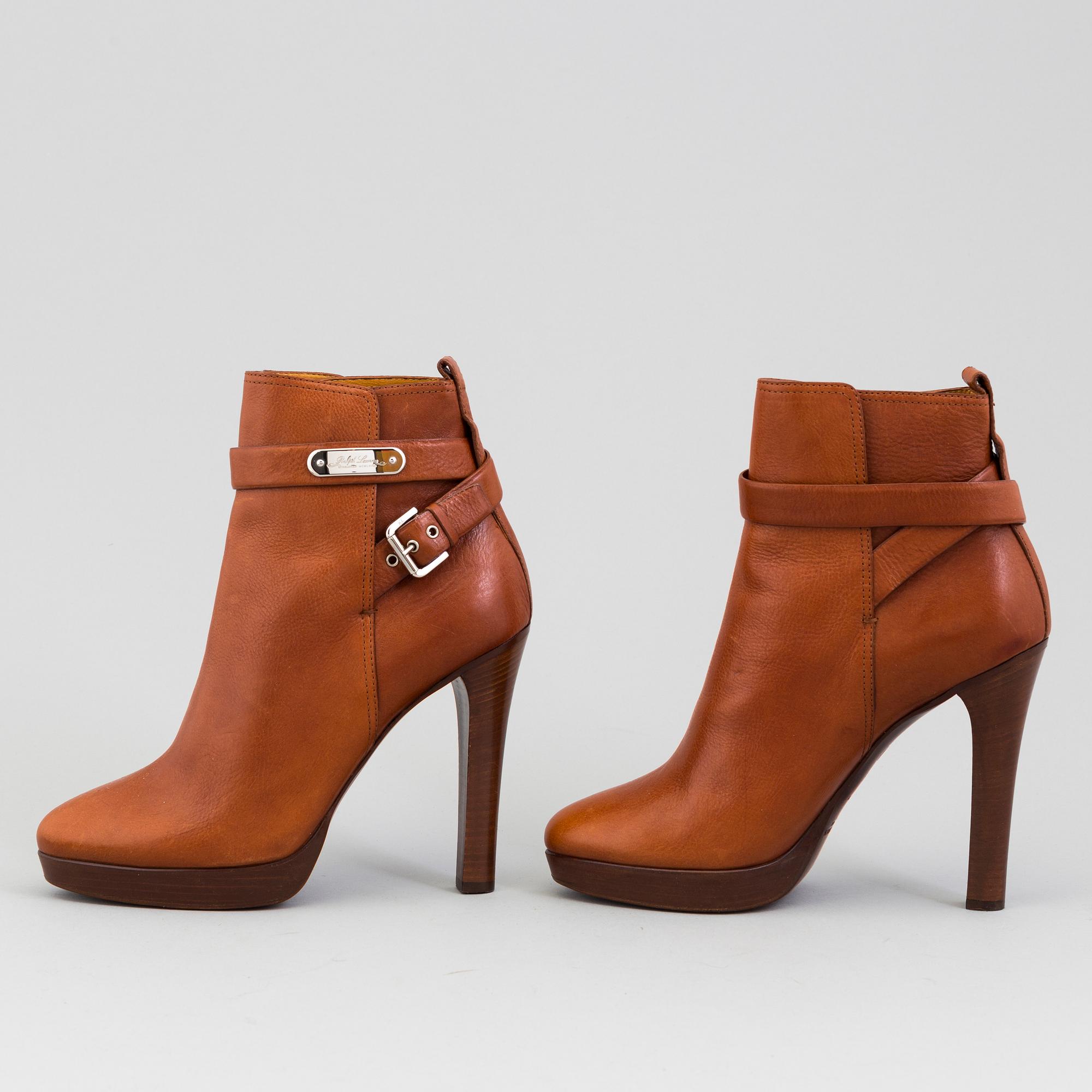 A pair of brandycoloured leather bootie by Raplh Lauren.