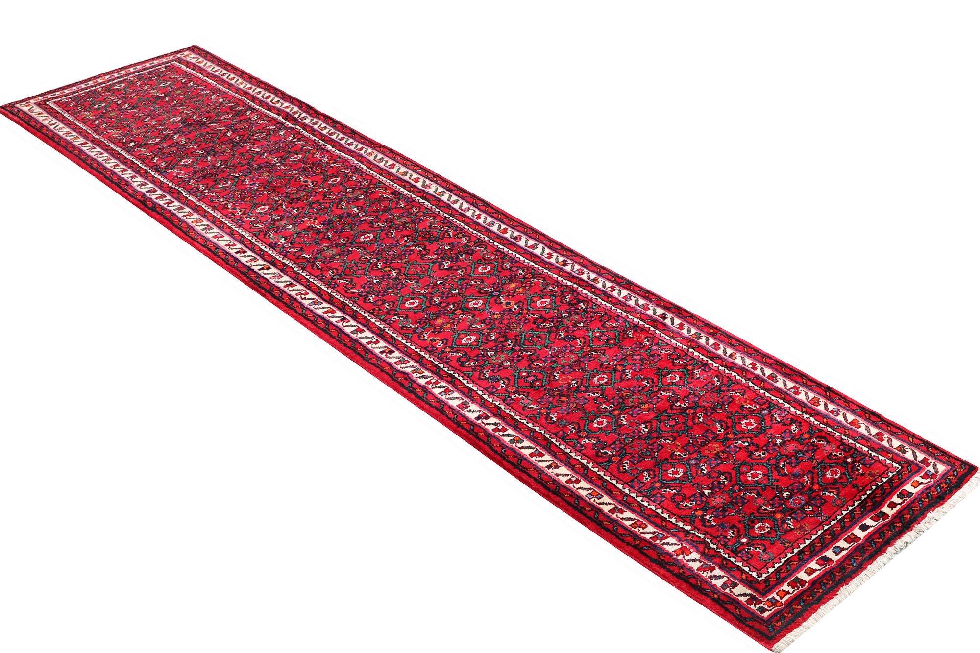 An oriental runner carpet, c. 395 x 87 cm.