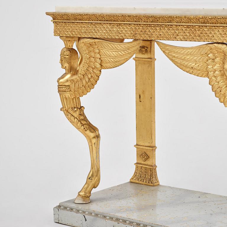 A late Gustavian giltwood console in the manner of J. Frisk, Stockholm, early 19th century.