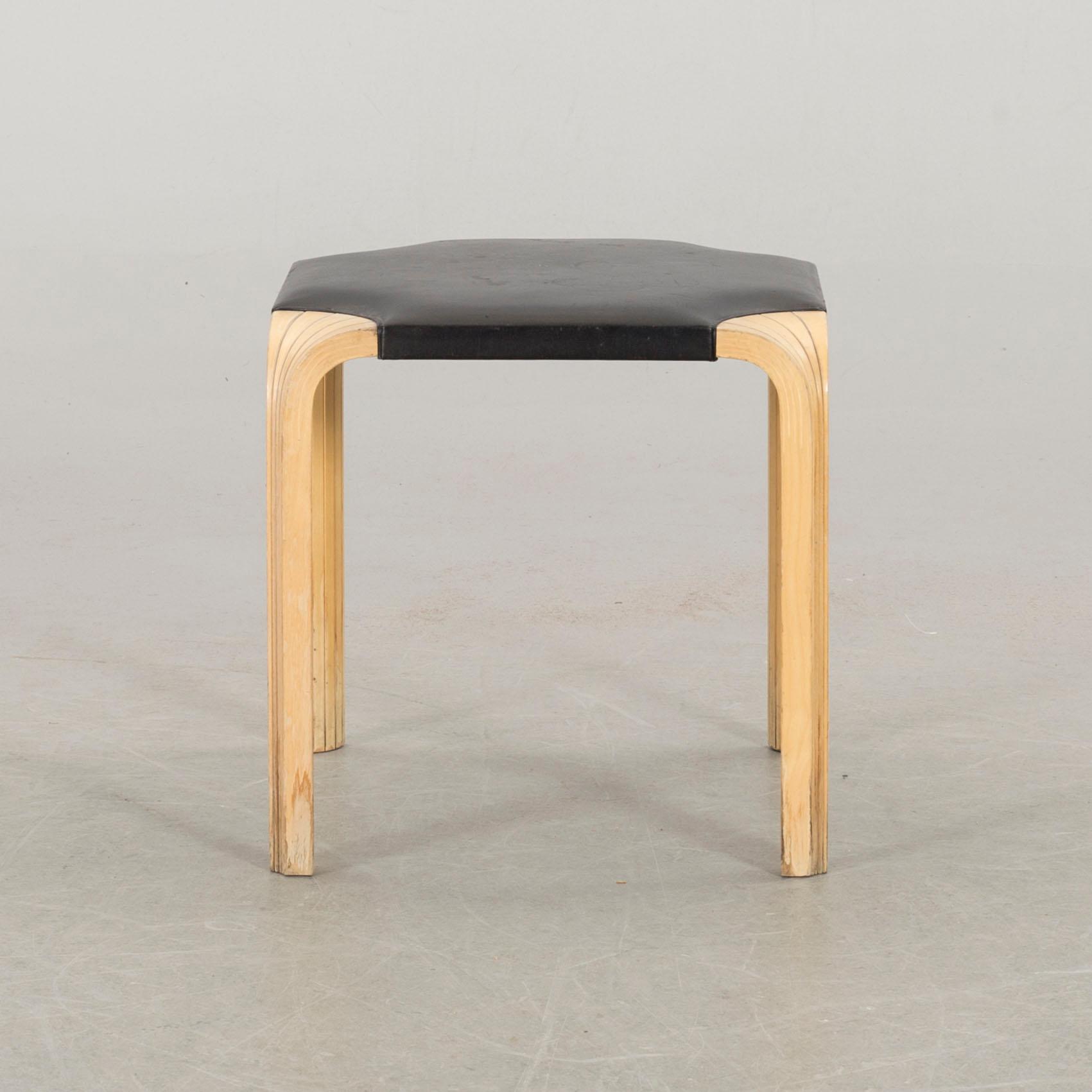 AN ALVAR AALTO "X602" STOOL by Artek.