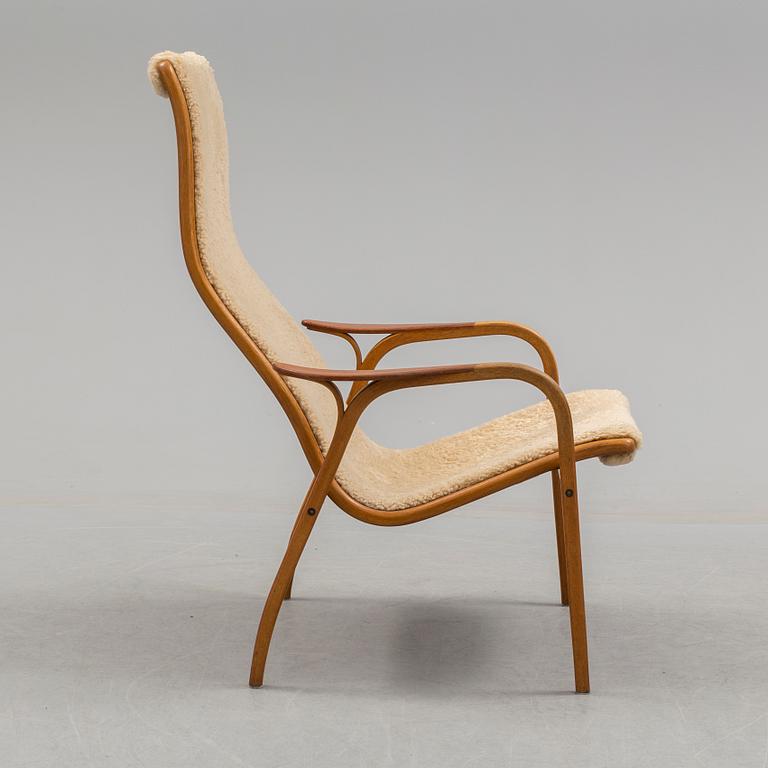 A Yngve Ekström teak and oak armchair.