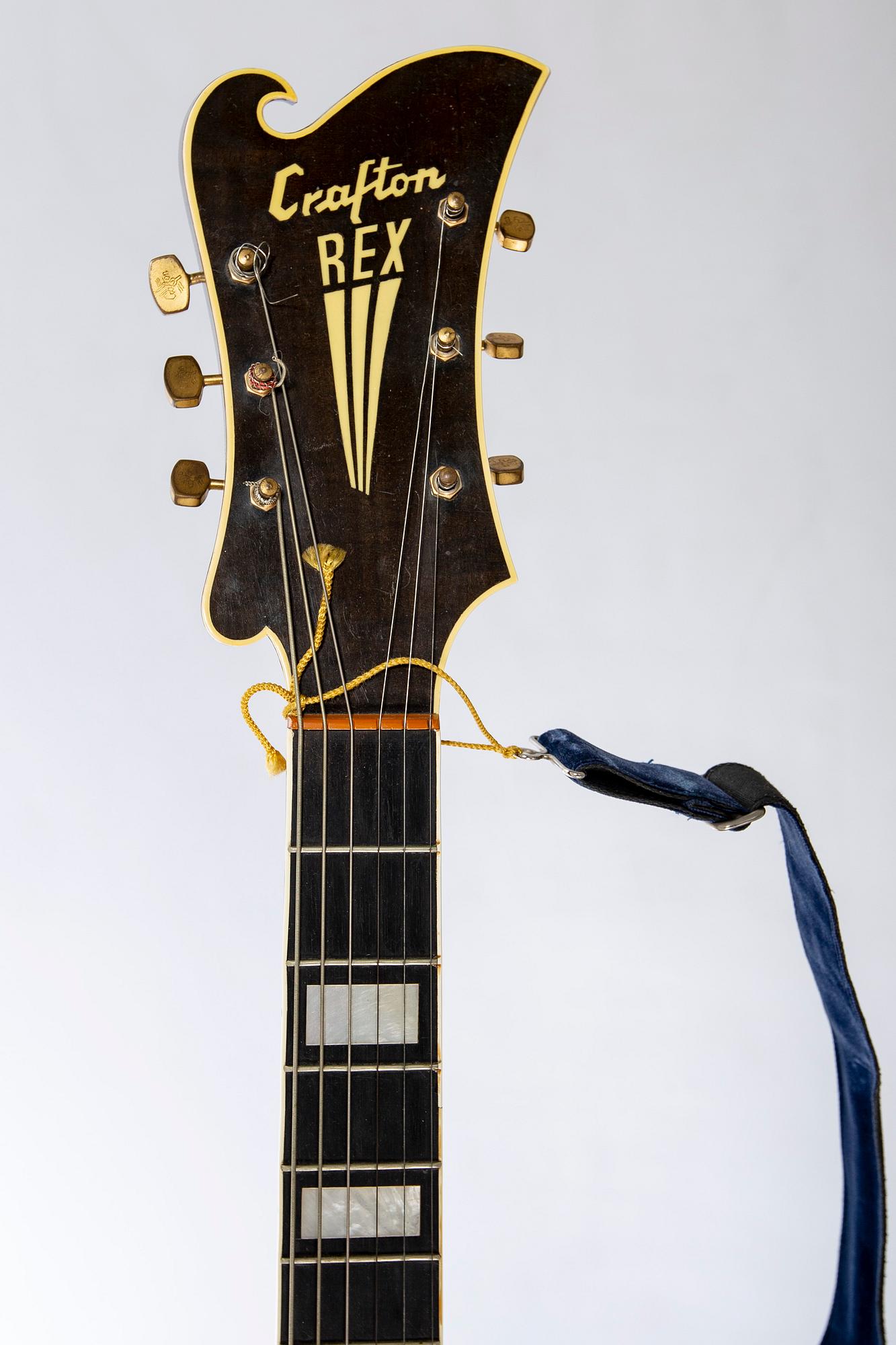 A Crafton Rex acoustic guitar.