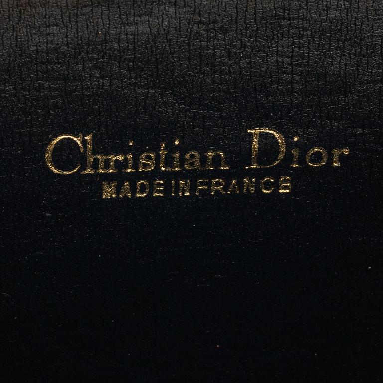 Christian Dior, a canvas clutch and wallet.