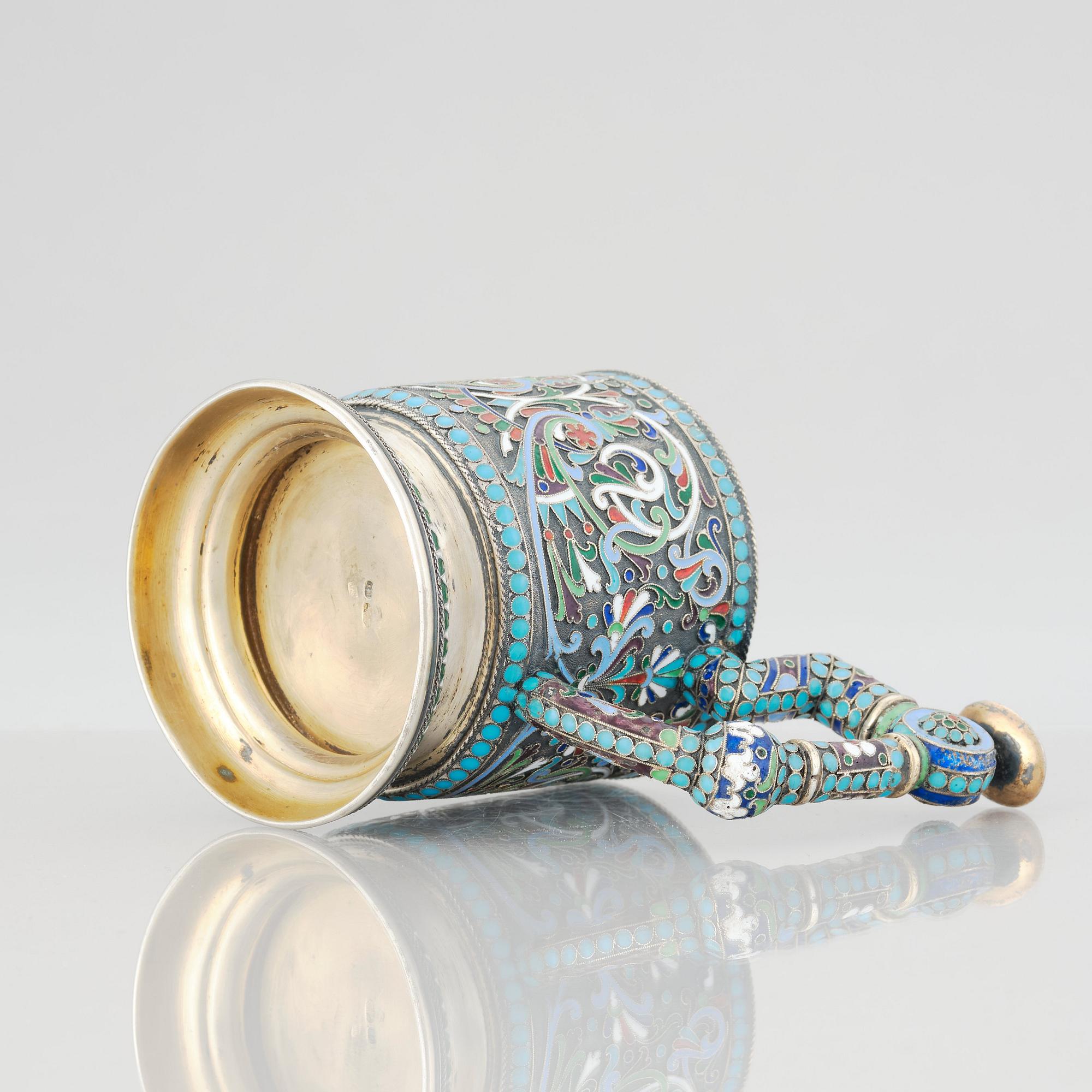 A Russian 19th Century silver-gilt and enamel tea-glass holder, unidentified makers mark, Moscow before 1899.