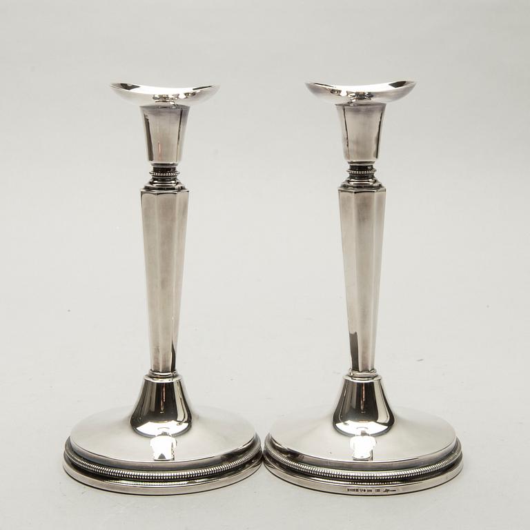 A Swedish 20th century pair of silver candle sticks mark of E Löfman Uppsala 1982.