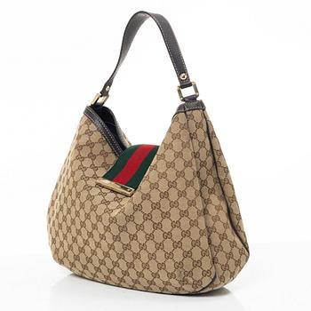 Gucci, GG Supreme bag.