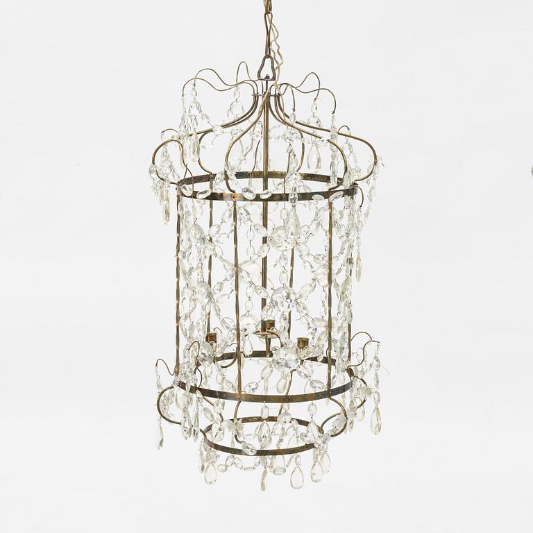 A three-light Gustavian-style hanging light, circa 1900.