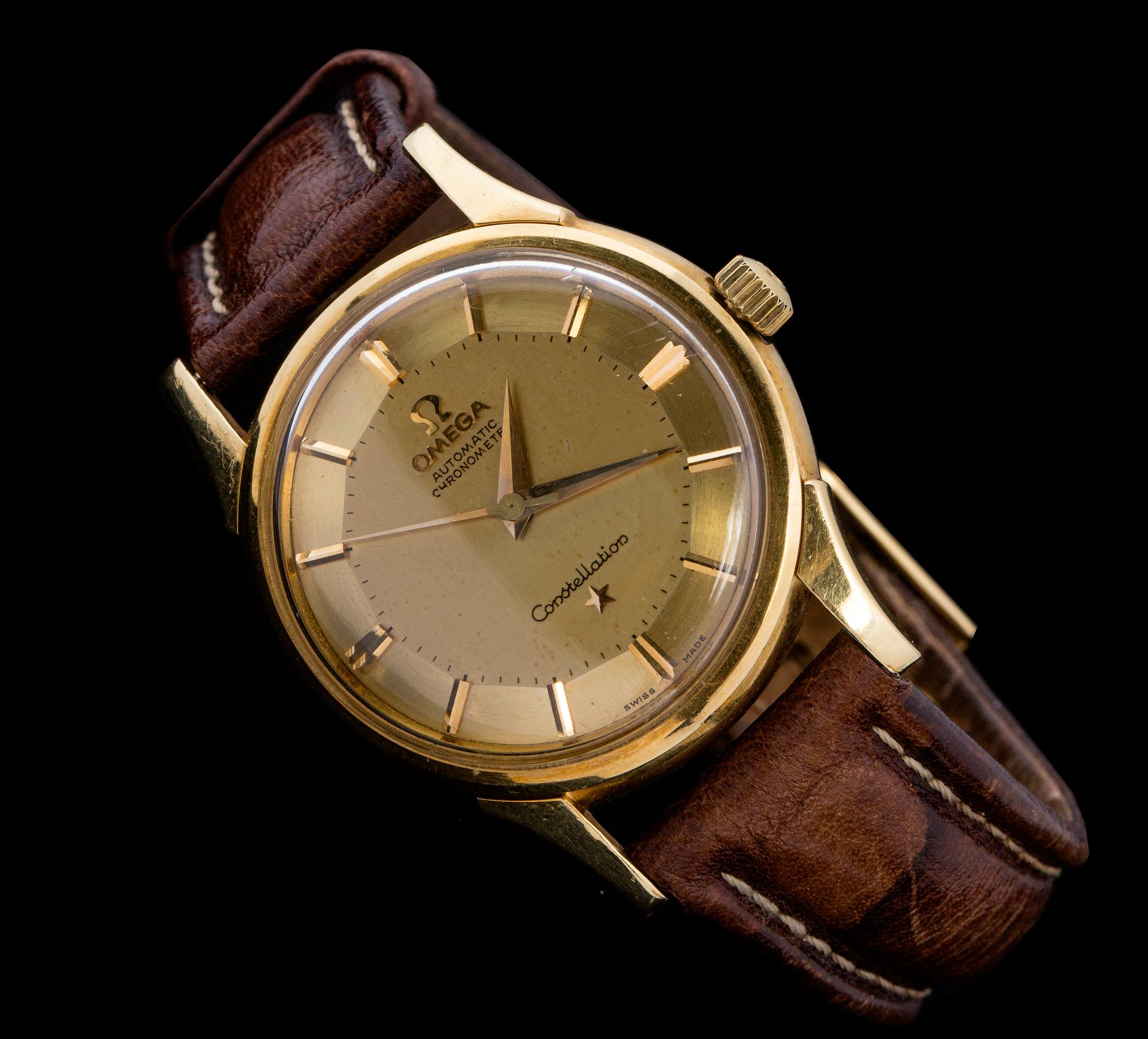 HERRARMBANDSUR, 18 K guld, Omega, Automatic Chronometer, Constellation. 1960-tal.