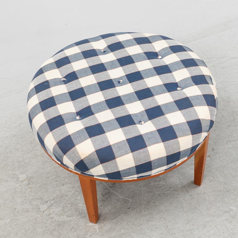 Josef Frank, a model 647 cherry wood stool by Firma Svenskt Tenn.