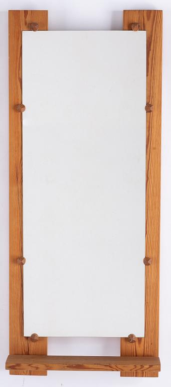 A pine mirror by Gunar Kanevad, signed and dated 1971.