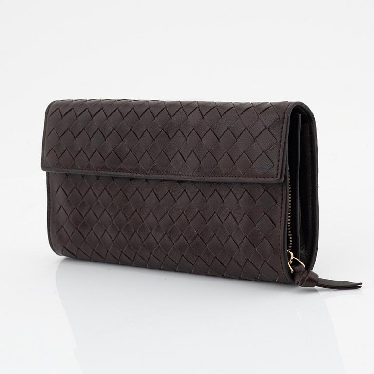 Bottega Veneta, a brown leather wallet.