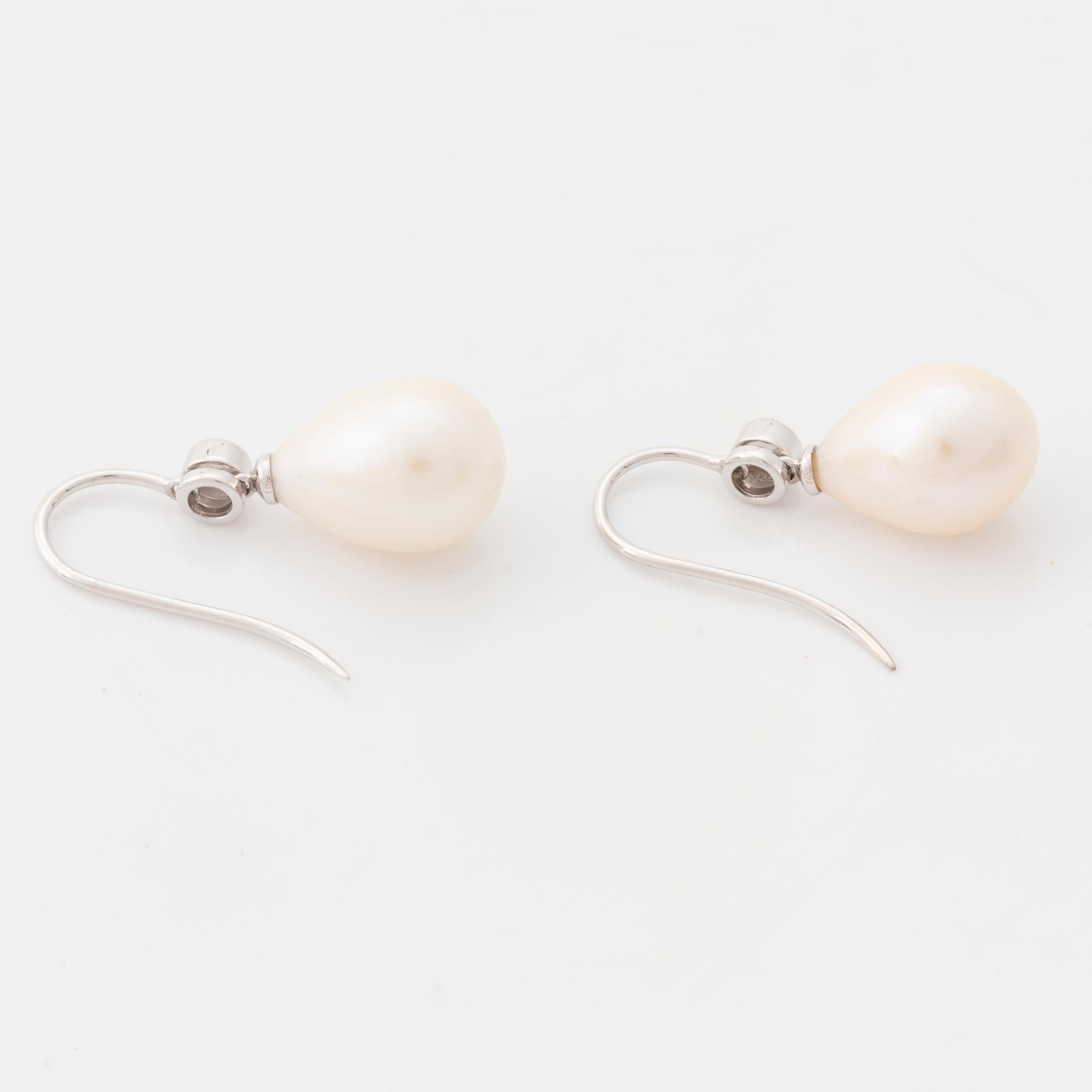 Cultured pearl and brilliant cut diamond earrings.