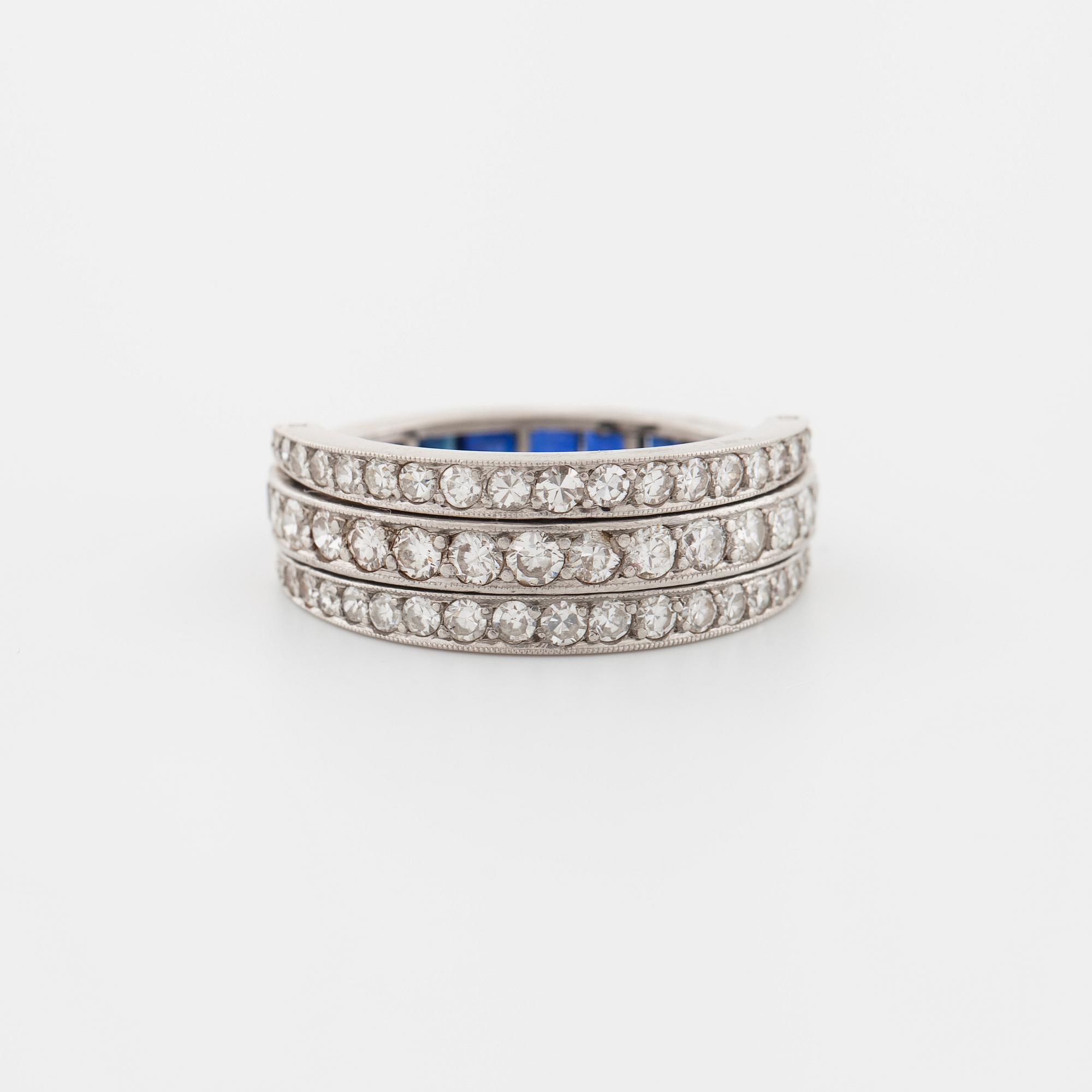 A square cut sapphire and single cut diamond ring.