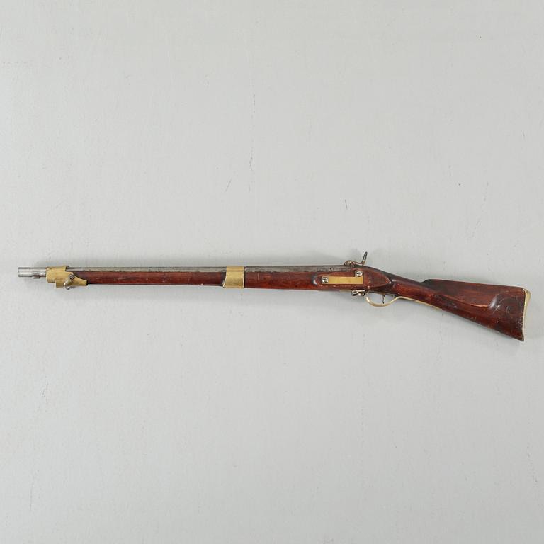 A percussion rifle, remade from flintlock rifle m/1820.