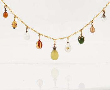 A FABERGÉ  GOLD Chain Necklace WITH 9 GOLD, ENAMEL ETC MINIATURE EASTER EGG PENDANTS, S.T PETERSBURG 1899-1908.