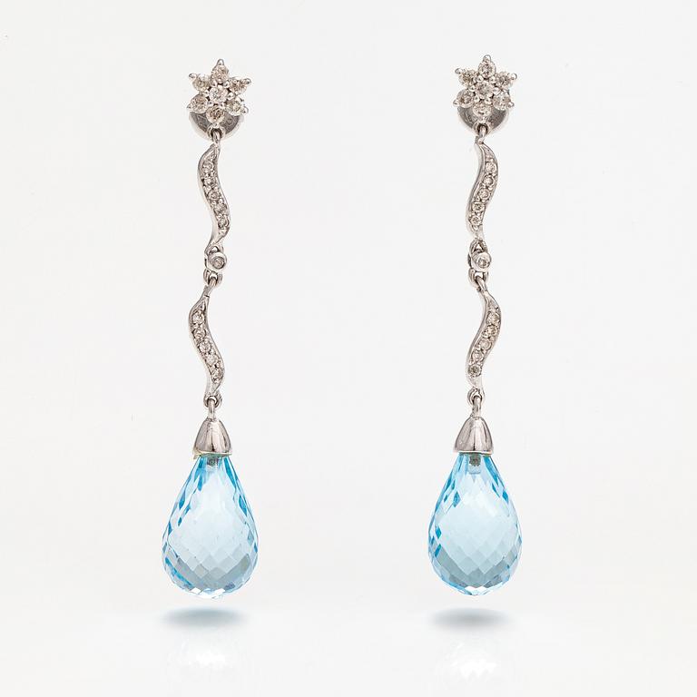 A pair of 18K white gold earrings with topazes and diamonds ca. 0.37 ct in total.