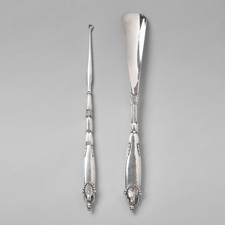 Georg Jensen, a shoehorn and a tool for tying shoe laces, Copenhagen ca 1918-20, 830/ 1000 silver.