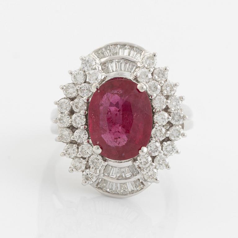 Ruby, baguette- and brilliant cut diamond ring.