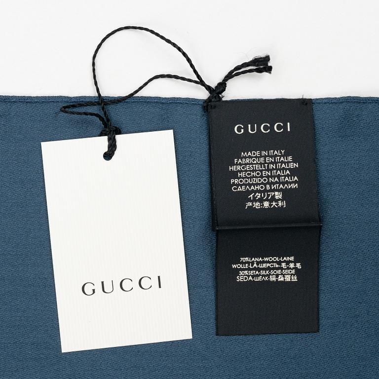 Gucci, a wool and silk mix "GG" jaquard shawl.