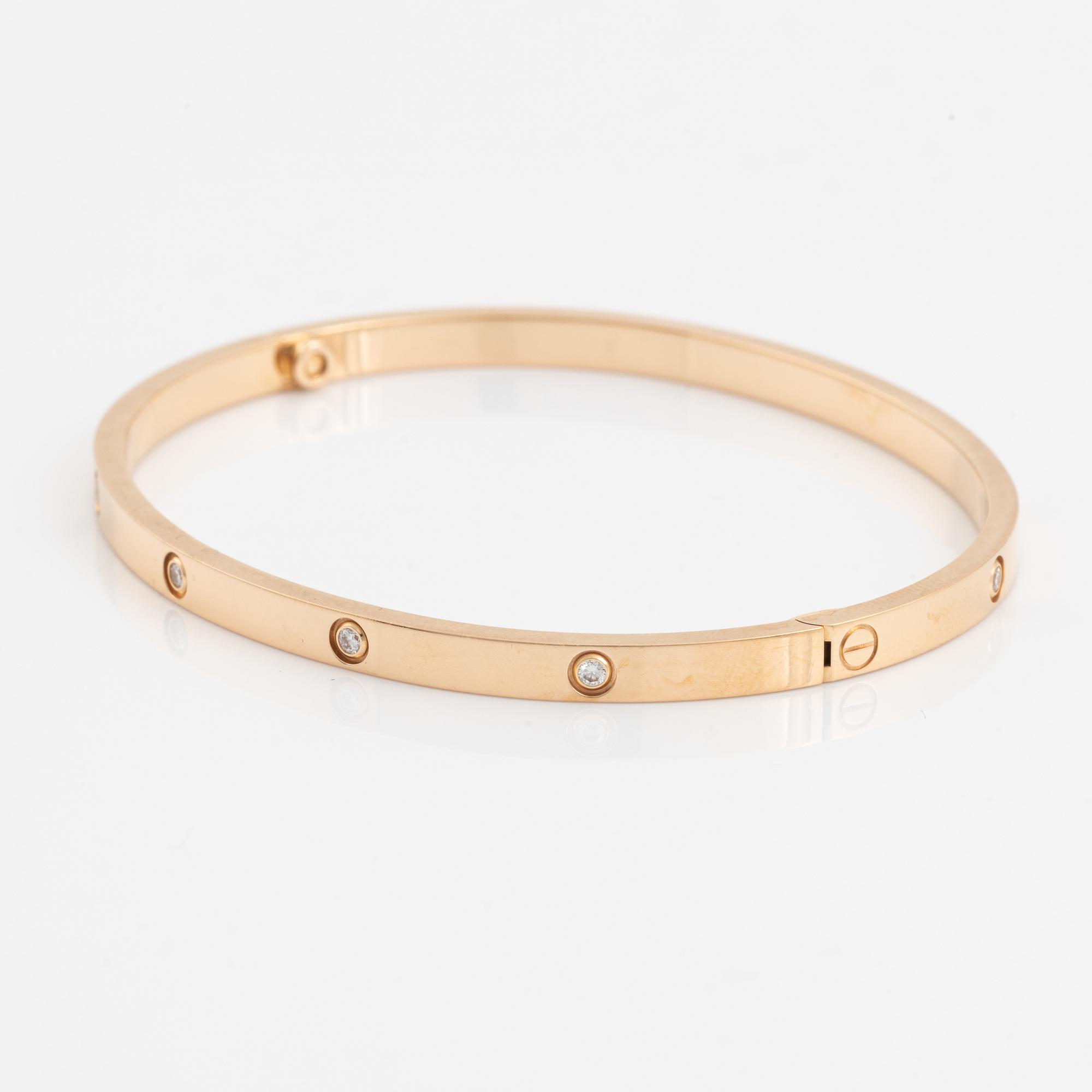 A Cartier "Love" bracelet small model in 18K rose gold with ten round brilliant-cut diamonds.